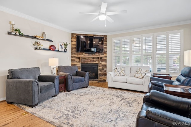 15501 Wolfboro Rd, Chesterfield, VA 23832 - living area with ornamental molding, a stone fireplace, a ceiling fan, and wood finished floors