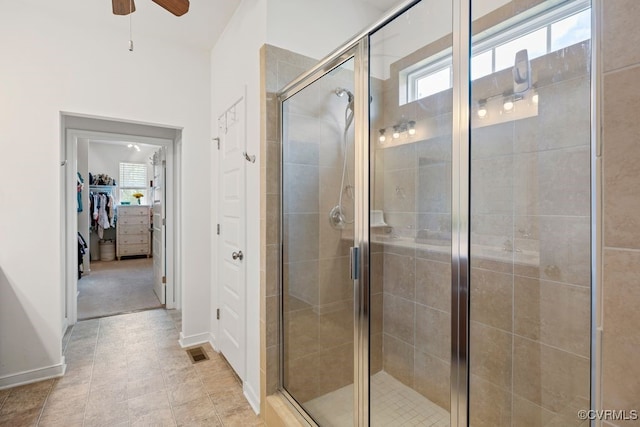 15501 Wolfboro Rd, Chesterfield, VA 23832 - bathroom with a walk in closet, ceiling fan, visible vents, a shower stall, and baseboards