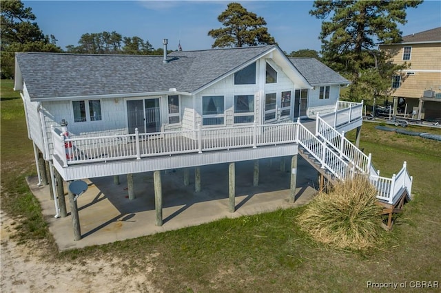 2000 Jenkins Neck Rd, Hayes, VA 23072 - back of property with a wooden deck, a patio area, and roof with shingles