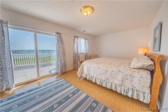 2000 Jenkins Neck Rd, Hayes, VA 23072 - bedroom featuring access to outside and wood finished floors