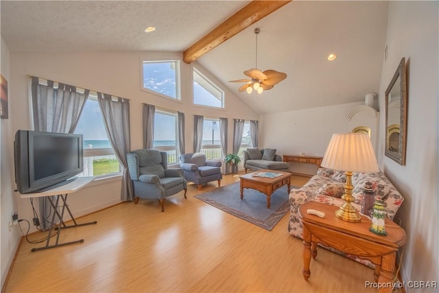 2000 Jenkins Neck Rd, Hayes, VA 23072 - living area featuring high vaulted ceiling, a ceiling fan, baseboards, wood finished floors, and beamed ceiling