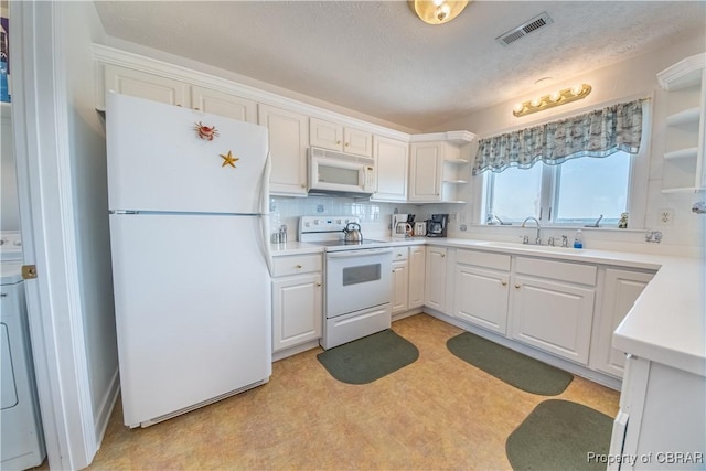 2000 Jenkins Neck Rd, Hayes, VA 23072 - kitchen featuring open shelves, a sink, white appliances, light countertops, and visible vents