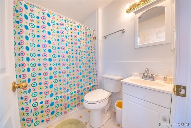 2000 Jenkins Neck Rd, Hayes, VA 23072 - full bath with tile walls, vanity, tile patterned floors, toilet, and a shower with shower curtain
