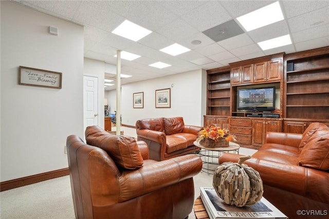 20145 Hunnicut Rd, Dinwiddie, VA 23803 - living room with light colored carpet, baseboards, built in features, and a paneled ceiling