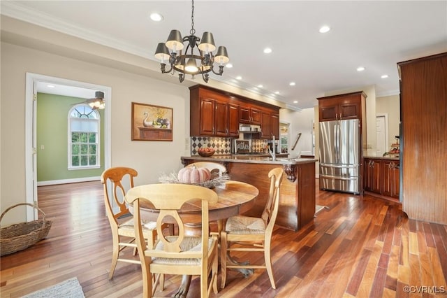 20145 Hunnicut Rd, Dinwiddie, VA 23803 - dining room featuring crown molding, dark wood-type flooring, recessed lighting, and a chandelier