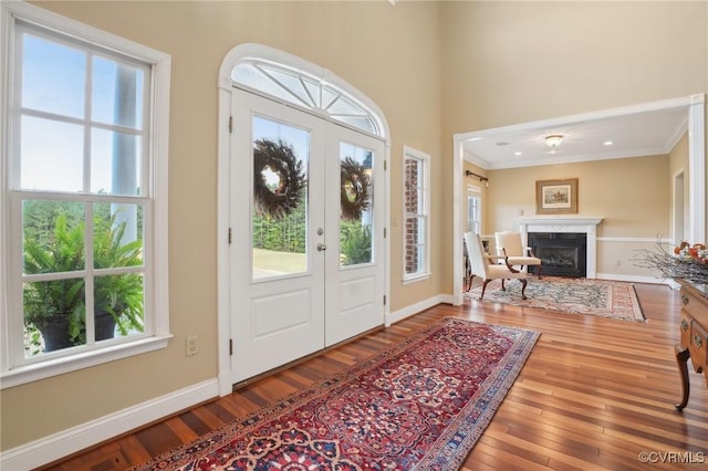 20145 Hunnicut Rd, Dinwiddie, VA 23803 - foyer entrance featuring wood-type flooring, ornamental molding, and a healthy amount of sunlight