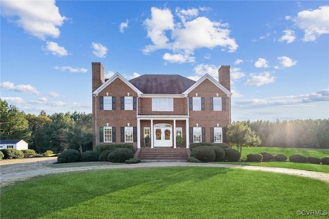 20145 Hunnicut Rd, Dinwiddie, VA 23803 - colonial-style house with brick siding, a front lawn, and a chimney