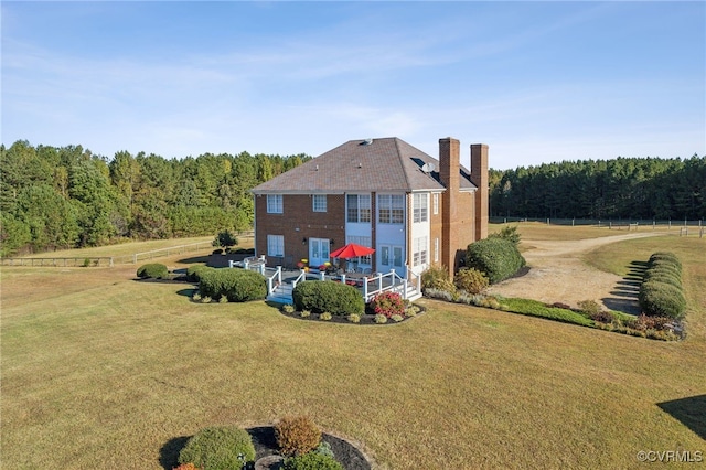 20145 Hunnicut Rd, Dinwiddie, VA 23803 - back of property featuring a lawn, a chimney, and a forest view