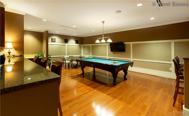 game room featuring crown molding, light wood-style flooring, and pool table
