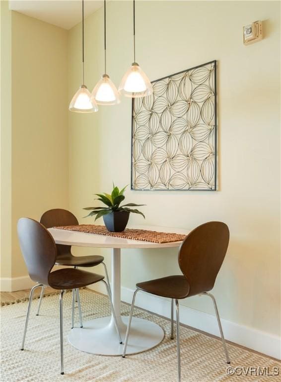 dining room with baseboards