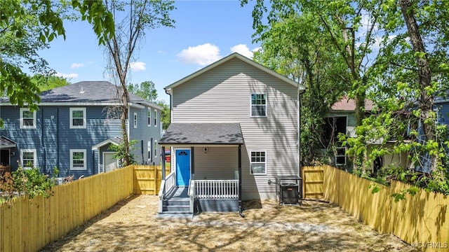 back of house featuring cooling unit and a fenced backyard