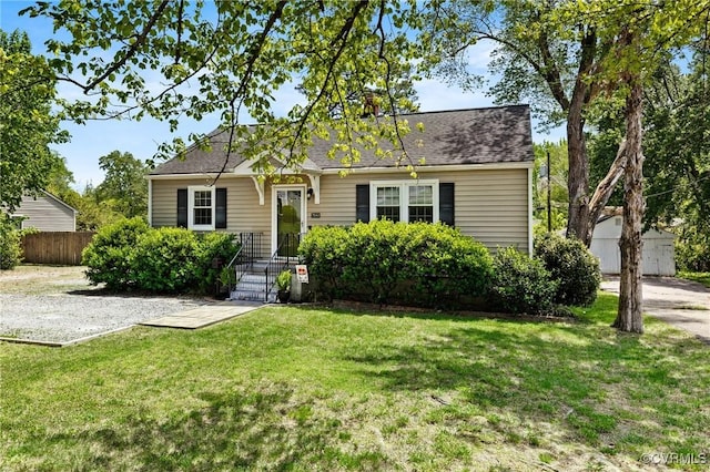 view of front of property with fence and a front yard