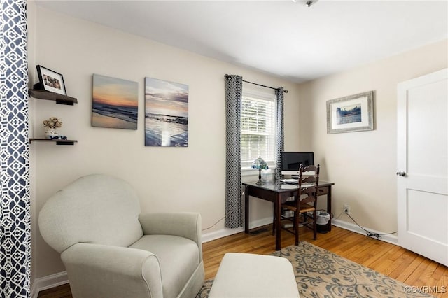 office with baseboards and wood finished floors