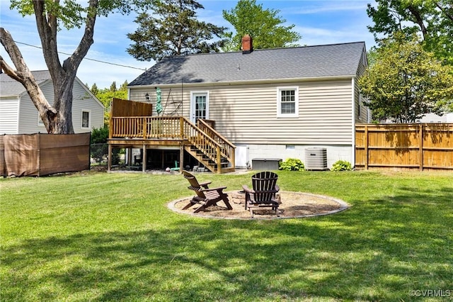 rear view of property with stairs, a wooden deck, a fenced backyard, cooling unit, and a yard