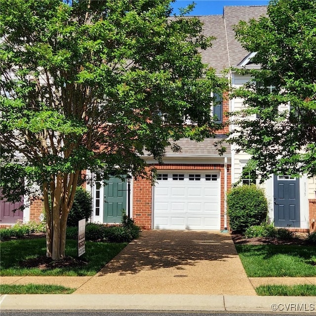 8133 Belton Cir, Mechanicsville, VA 23116 - obstructed view of property featuring brick siding, driveway, an attached garage, and a shingled roof