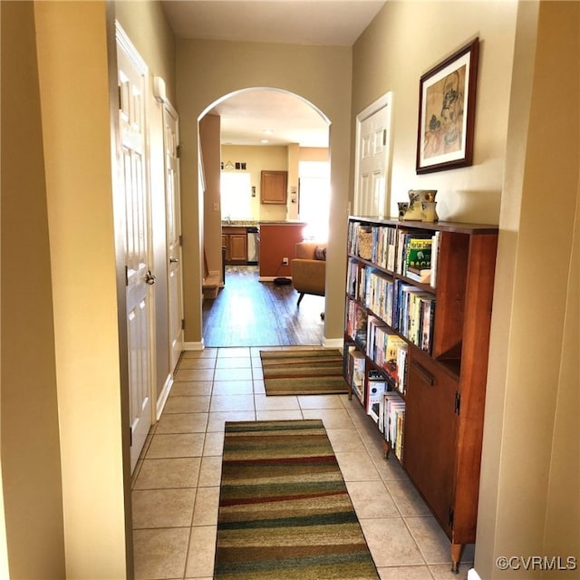 8133 Belton Cir, Mechanicsville, VA 23116 - corridor with arched walkways, light tile patterned flooring, and baseboards