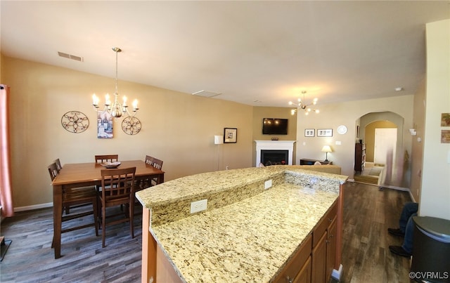 8133 Belton Cir, Mechanicsville, VA 23116 - kitchen with a chandelier, arched walkways, open floor plan, dark wood finished floors, and a center island