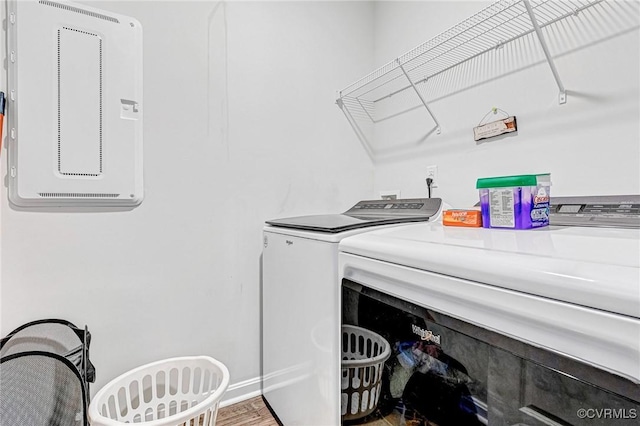 clothes washing area featuring laundry area and washer and clothes dryer