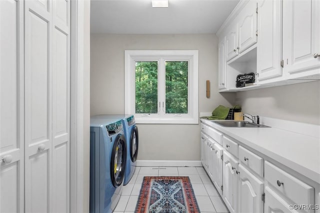 3640 Michaux Mill Dr, Powhatan, VA 23139 - laundry room featuring cabinet space, washing machine and dryer, baseboards, and light tile patterned floors