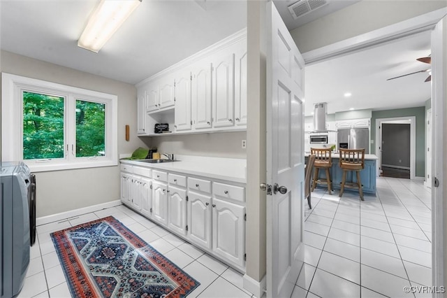 3640 Michaux Mill Dr, Powhatan, VA 23139 - kitchen with white cabinetry, stainless steel refrigerator with ice dispenser, light countertops, light tile patterned floors, and island range hood