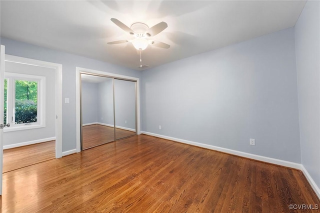 3640 Michaux Mill Dr, Powhatan, VA 23139 - unfurnished bedroom featuring baseboards, wood finished floors, a closet, and ceiling fan
