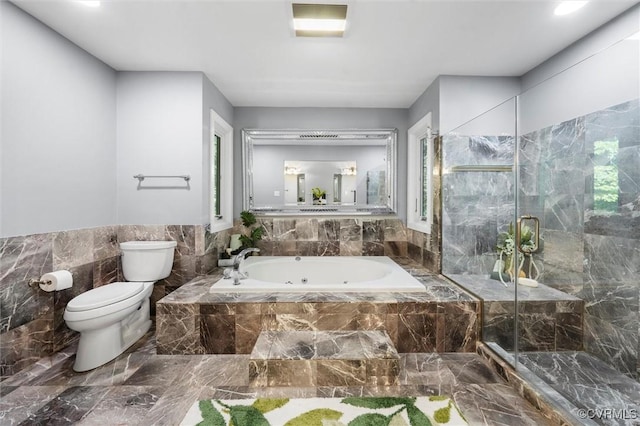 3640 Michaux Mill Dr, Powhatan, VA 23139 - bathroom featuring marble finish flooring, a whirlpool tub, toilet, a marble finish shower, and tile walls