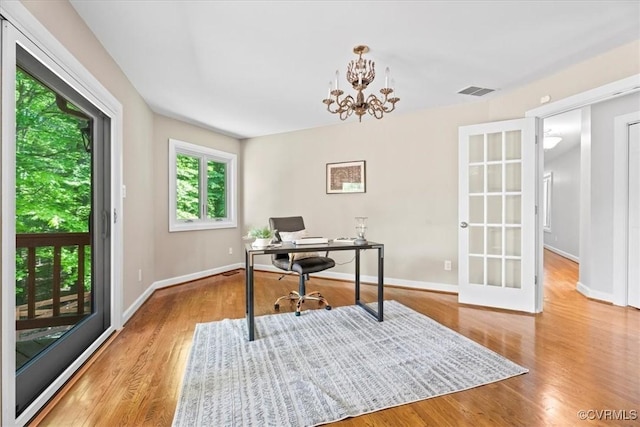 3640 Michaux Mill Dr, Powhatan, VA 23139 - office space featuring wood finished floors, baseboards, and a chandelier