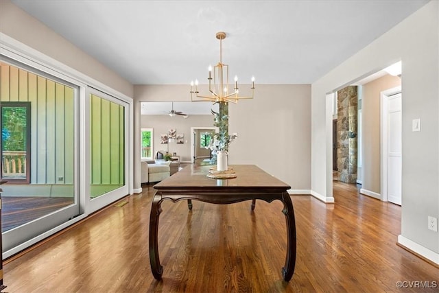 3640 Michaux Mill Dr, Powhatan, VA 23139 - dining area with wood finished floors, a chandelier, and baseboards