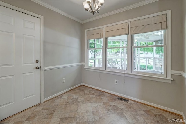 empty room with visible vents, stone finish flooring, baseboards, and an inviting chandelier