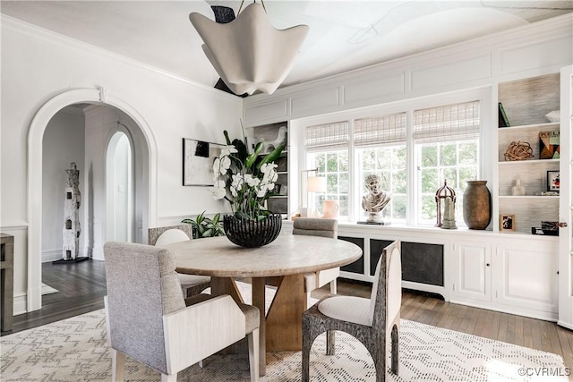 7 River Rd, Richmond, VA 23226 - dining area featuring arched walkways, crown molding, and wood finished floors