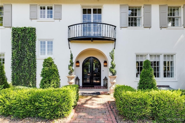 7 River Rd, Richmond, VA 23226 - view of exterior entry featuring a balcony, french doors, and stucco siding