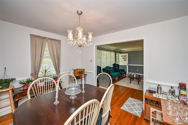 dining room featuring an inviting chandelier and wood finished floors