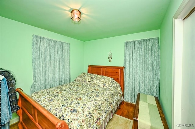 bedroom featuring wood finished floors