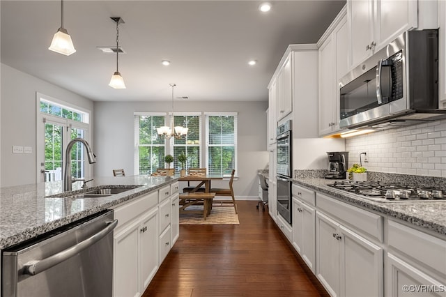 kitchen with visible vents, appliances with stainless steel finishes, a sink, recessed lighting, and white cabinetry
