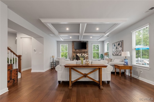 living room with visible vents, baseboards, stairway, coffered ceiling, and dark wood finished floors