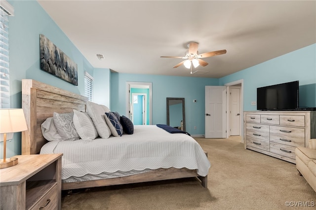 bedroom featuring ceiling fan and light carpet