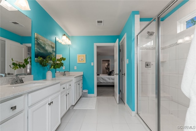 full bath with visible vents, a sink, double vanity, and a shower stall