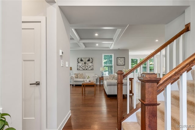stairway featuring wood-type flooring, recessed lighting, baseboards, beamed ceiling, and coffered ceiling