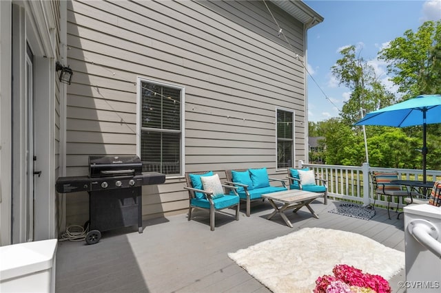 view of patio / terrace with outdoor lounge area, a deck, and area for grilling