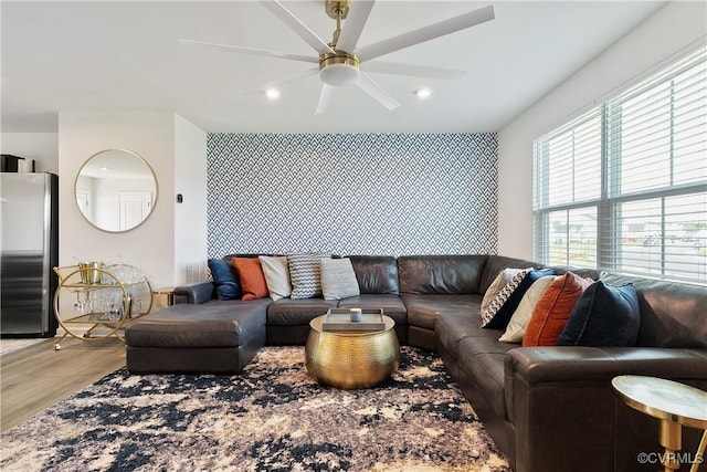 living area with recessed lighting, ceiling fan, wood finished floors, and visible vents