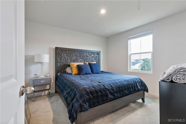 carpeted bedroom with baseboards