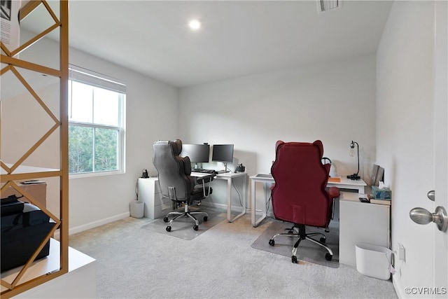 office area featuring carpet floors, baseboards, and visible vents