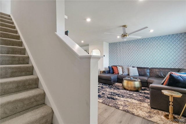 living room with recessed lighting, a ceiling fan, wood finished floors, and stairway