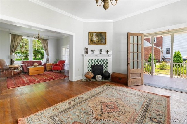 510 Cedar Ln, Hopewell, VA 23860 - living room featuring a chandelier, hardwood / wood-style floors, crown molding, and a wood stove