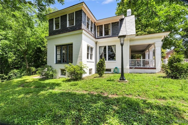 510 Cedar Ln, Hopewell, VA 23860 - back of house with a chimney, a lawn, and mansard roof