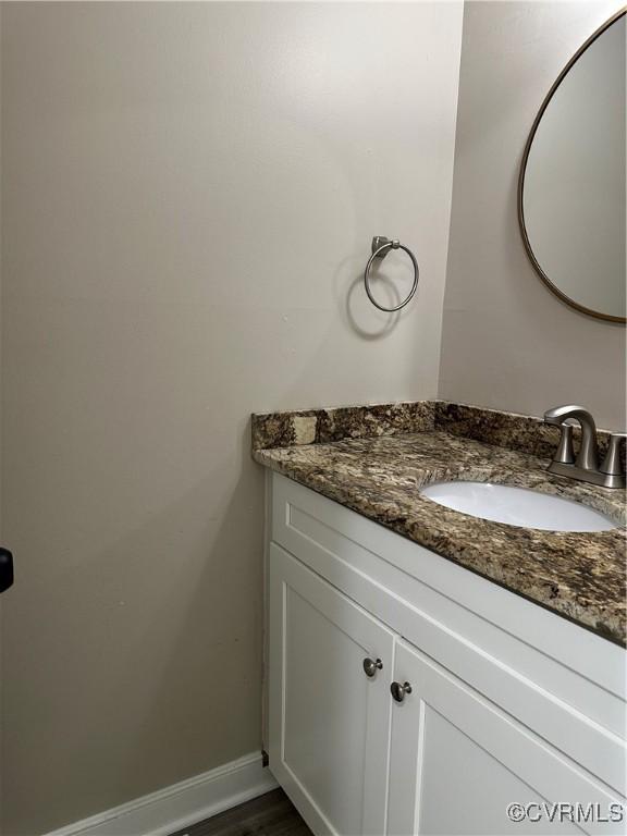 1916 Boardman Ln, Henrico, VA 23238 - bathroom with vanity, wood finished floors, and baseboards