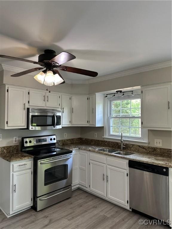 1916 Boardman Ln, Henrico, VA 23238 - kitchen with stainless steel appliances, ornamental molding, a sink, and white cabinets