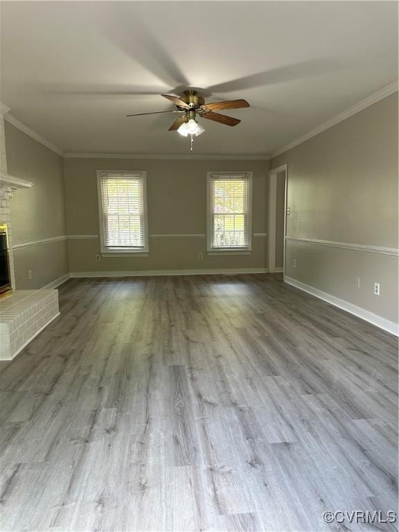 1916 Boardman Ln, Henrico, VA 23238 - unfurnished living room featuring a ceiling fan, ornamental molding, a brick fireplace, baseboards, and wood finished floors