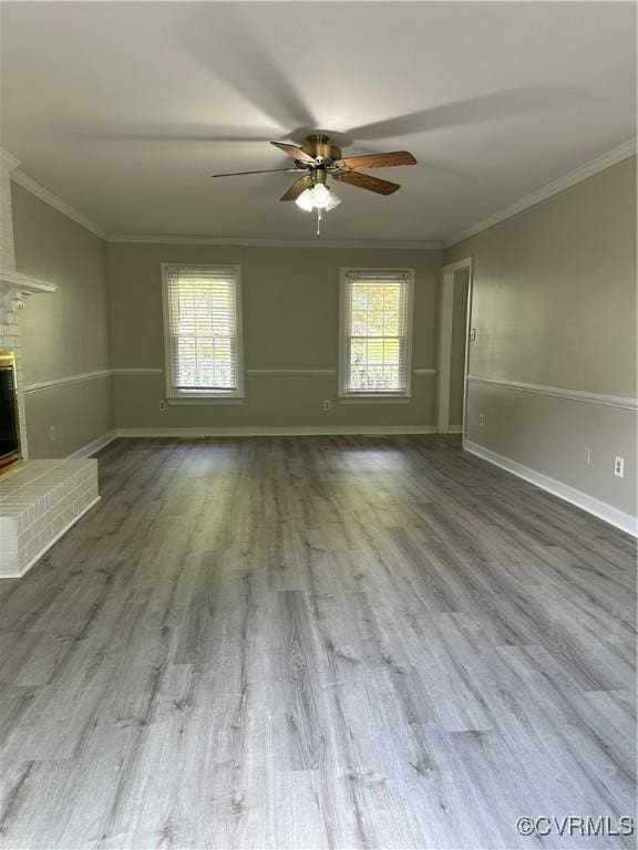 1916 Boardman Ln, Henrico, VA 23238 - unfurnished living room featuring ceiling fan, healthy amount of natural light, crown molding, and wood finished floors
