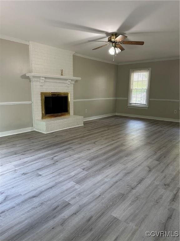 1916 Boardman Ln, Henrico, VA 23238 - unfurnished living room with crown molding, a ceiling fan, wood finished floors, a fireplace, and baseboards